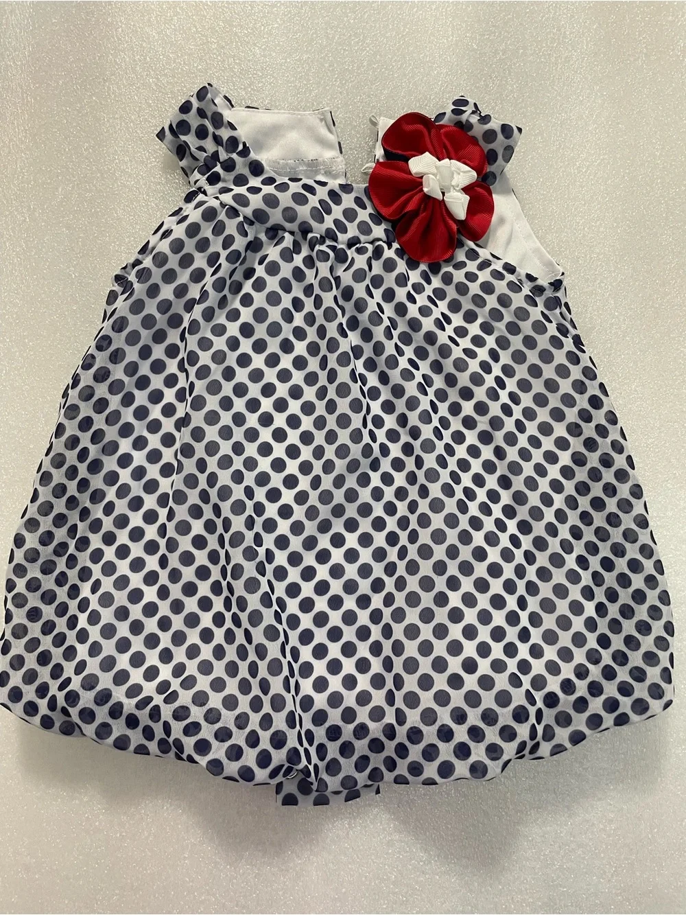 Rare Editions Gray Polka Dot Bib with Red Flower Accent